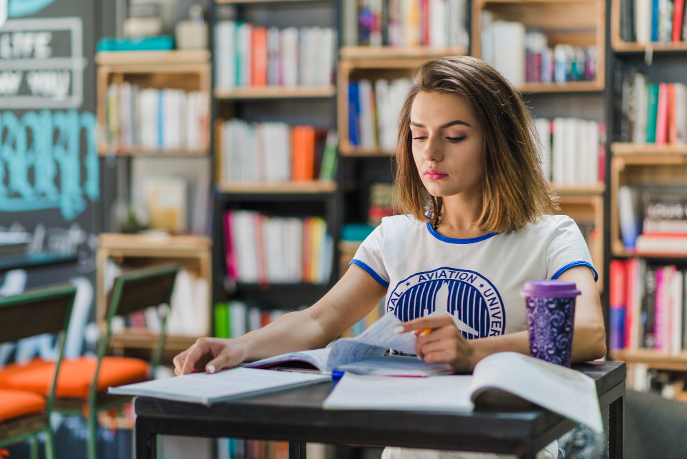 Young female student studying at her desk
